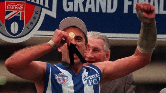 Wayne Schwass with his premiership medal after the 1996 Grand Final. Picture: Wayne Ludbey