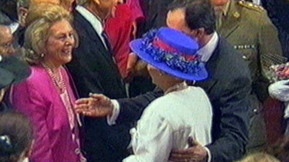 Prime Minister Paul Keating puts his hand on Queen Elizabeth II's back as she is introduced to businesswoman Janet Holmes a' Court during her visit to Canberra in 1992.