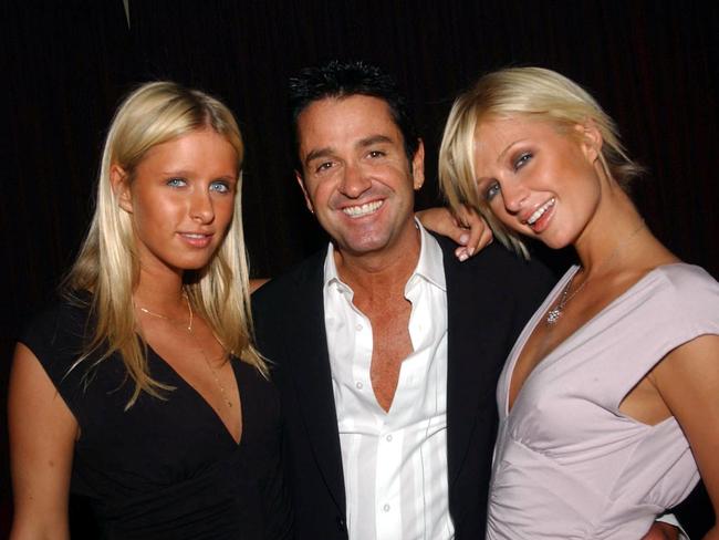 Paris and Nicky Hilton with Darren Thornburgh in 2003.