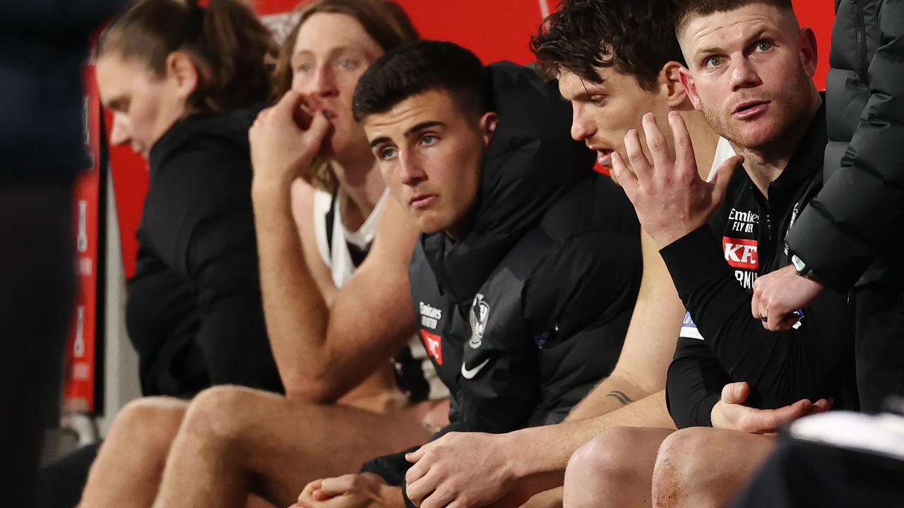 MELBOURNE, AUSTRALIA - August 5 , 2023. AFL . Injured Pies Taylor Adams, Brody Mihocek, Nick Daicos, Nathan Murphy and Tom Mitchell back row on the bench last qtr during the round 21 match between the Hawthorn and Collingwood at Marvel Stadium in Melbourne. Photo by Michael Klein.
