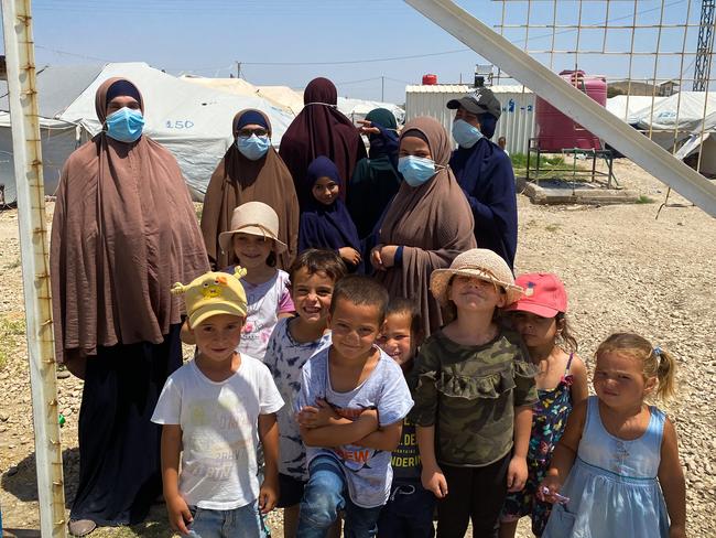 Australian women and children at al-Roj camp in northeastern Syria. The woman are (L-R) Mariam Dabboussy, Aminah Assaad, Nesrine Zahab (she has her back turned, tall one at the back), Shayma Assaad and Bessima Assaad (Bessima is in the black cap) Children are (L-R) Abdul Rahman (first left), son of Nesrine Zahab, Alaa & Umayr (third and fourth from left), sons of Shayma Assaad, and far right Mariam, daughter of Shayma Assaad.Picture: Ellen Whinnett / The Australian