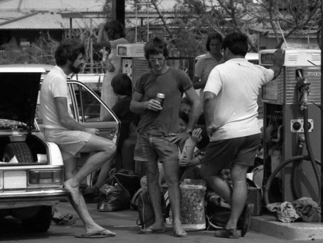 Cyclone Tracy caused major destruction to Darwin. Survivors, lacking both petrol and power, have a beer at the BP station in Fannie Bay in Darwin in the aftermath of Cyclone Tracy, which devastated the town on Christmas morning in 1974. Picture: Beat Erismann.