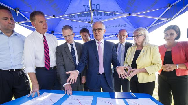 Australian Prime Minister Malcolm Turnbull looking over plans for the M1 upgrade (AAP Image/Glenn Hunt)