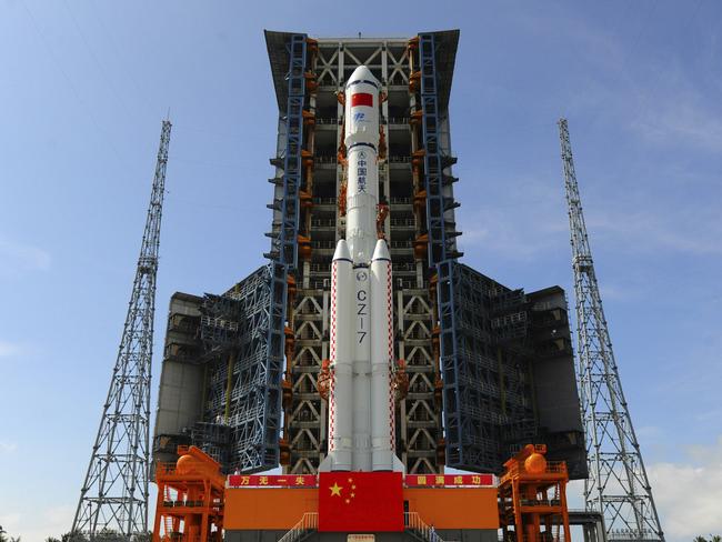 The Long March 7 rocket carrying the Tianzhou 1 cargo spacecraft is transferred to the launch pad. Picture: Chinatopix via AP