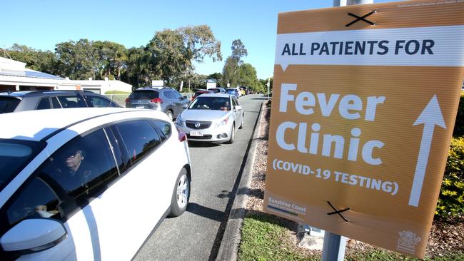 People in cars queue for Covid-19 testing at Caloundra Hospital. Picture: Steve Pohlner