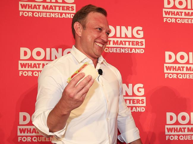 Premier Steven Miles holds his party launch at the North Lakes Community Centre. Premier Miles makes a sandwich with his daughter Bridie 10 on stage. Pics Adam Head