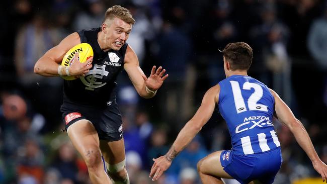 Patrick Cripps fends off North Melbourne’s Jy Simpkin in Round 4. Picture: Getty Images