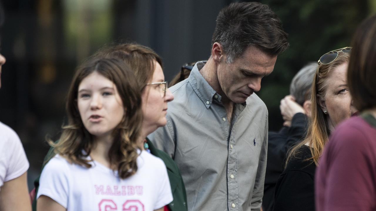 NSW Premier Chris Minns pictured marching with family at The 