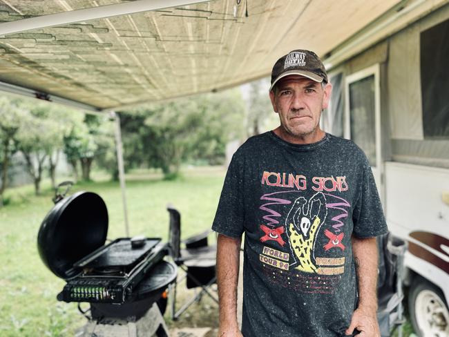 Adam McLarty near his camper at the front of his house in Murchison