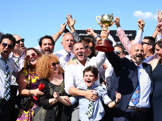 Verry Elleegant owners Brae Sokolski and Ozzie Kheir celebrate with the Lexus Melbourne Cup after James Mcdonald rode #4 Verry Elleegant to victory in race 7. Picture: Quinn Rooney/Getty Images