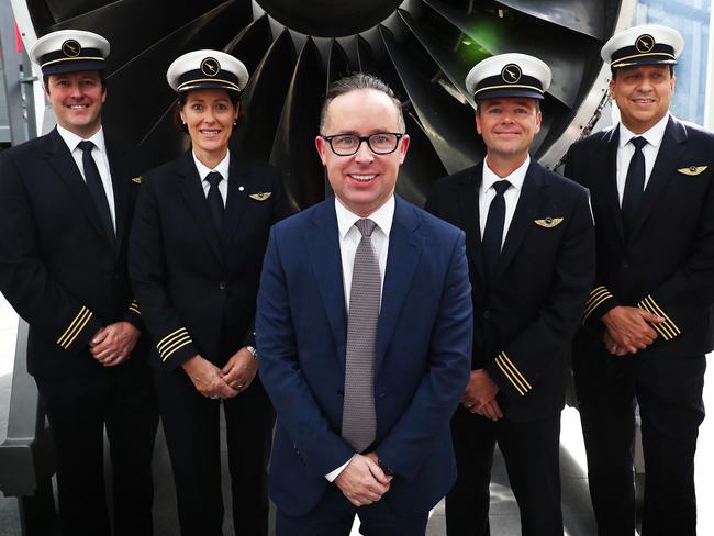 25/8/17: Qantas CEO Alan Joyce poses with some Qantas crew after reporting Qantas full year financial result at Qantas HQ in Sydney. John Feder/The Australian.