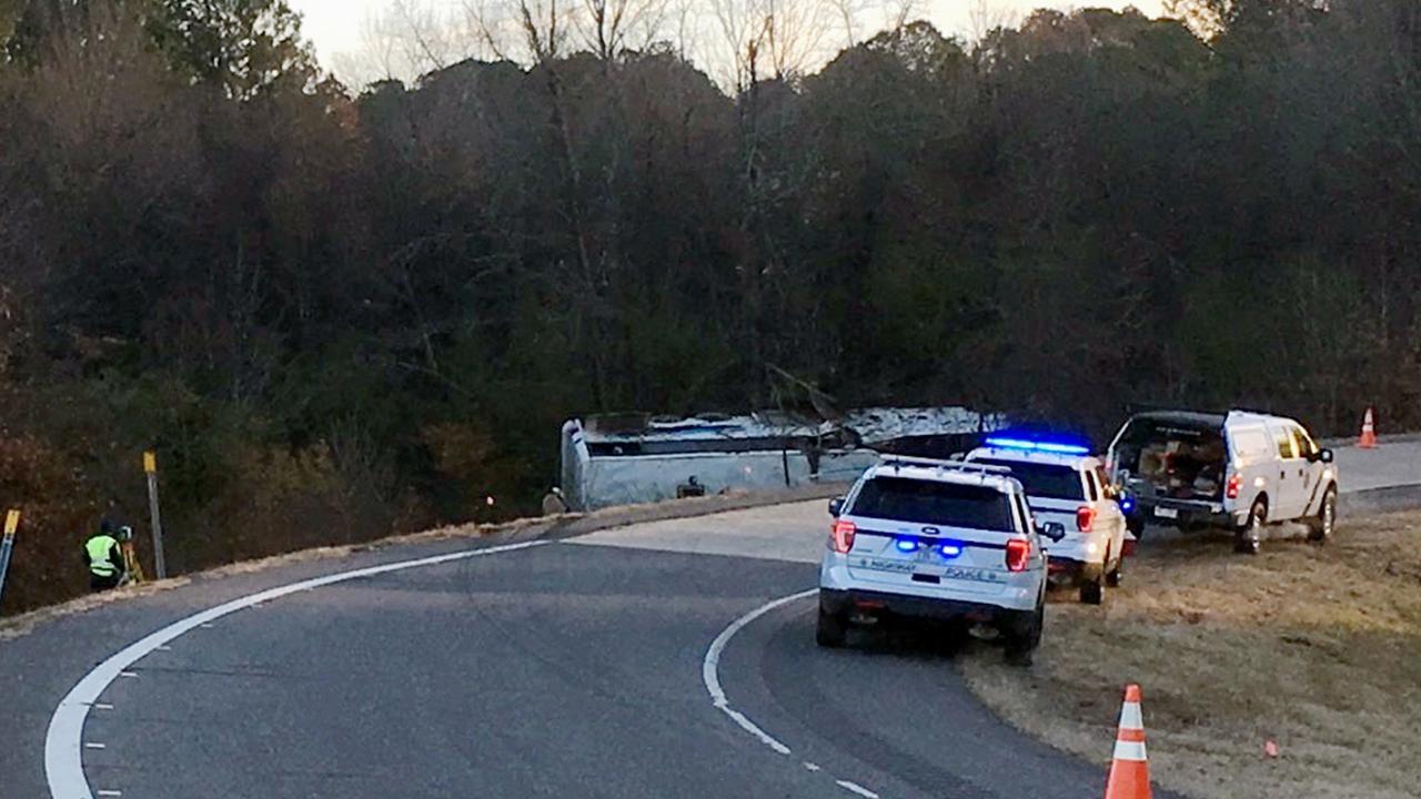 Emergency personnel work at the scene where the charter bus crashed and flipped. Picture: Josh Snyder/The Arkansas Democrat-Gazette