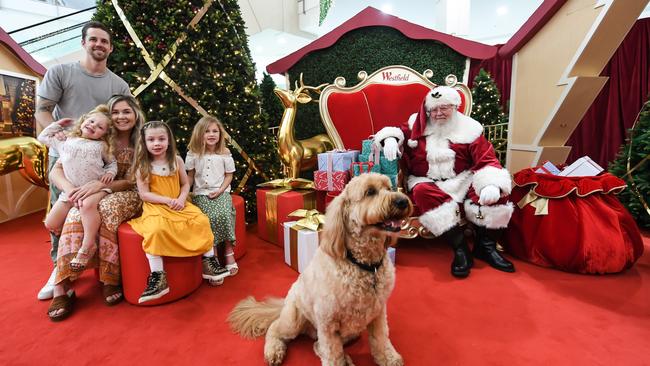 Saint Nick also saw Kirk and Tara Thompson, with kids Indy, Willow, Ava, and Iggy the dog at a Westfield shopping centre. Picture: James D. Morgan / Getty Images