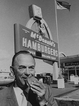 Business genius ... McDonald's fast food founder Ray Kroc eats a hamburger outside one of the first franchises. Picture: Supplied