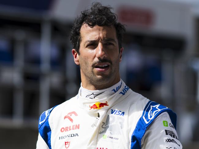 NORTHAMPTON, ENGLAND - JULY 06: 15th placed qualifier Daniel Ricciardo of Australia and Visa Cash App RB walks in the Pitlane during qualifying ahead of the F1 Grand Prix of Great Britain at Silverstone Circuit on July 06, 2024 in Northampton, England. (Photo by Rudy Carezzevoli/Getty Images)