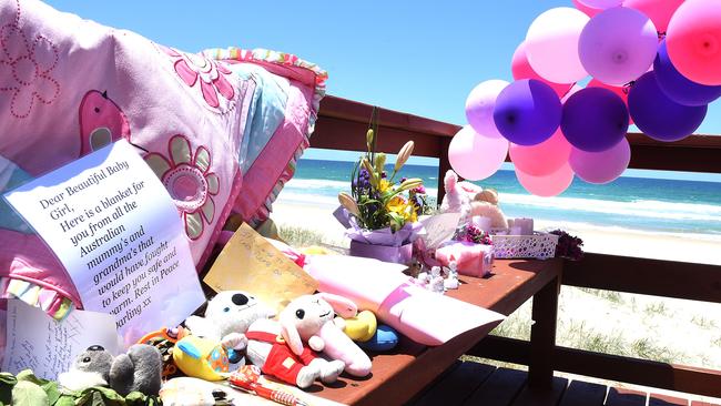 Toys and other mementos have been left at Surfers Paradise beach after a nine-month-old baby was found dead on the shoreline. Picture: AAP/John Gass