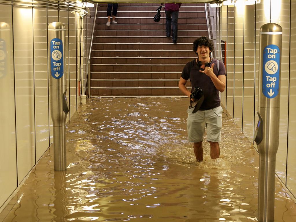 Commuters struggle against torrential rain and gale force winds in Lewisham as Sydney is lashed with a monumental early summer storm, 28/11/18. Picture: Nicholas Eagar