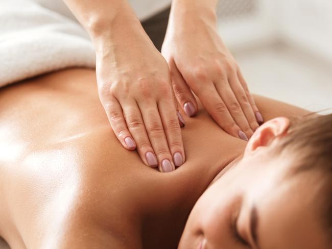 Young woman enjoying therapeutic neck massage in spa center, closeup. Picture: istock