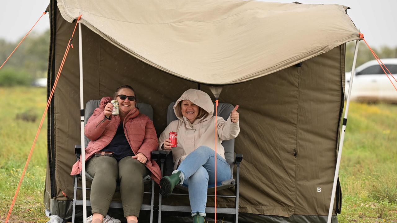 Revellers making the most of the wet, cold and muddy conditions. Picture: Lyndon Mechielsen/MaxAgency