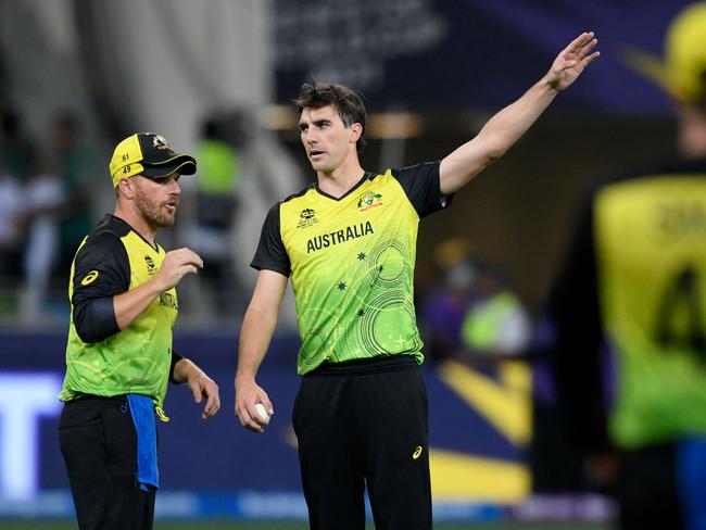 Pat Cummins (R) would be a safe pair of hands to replace Aaron Finch (L) as T20 captain. Picture: Aamir Qureshi/AFP