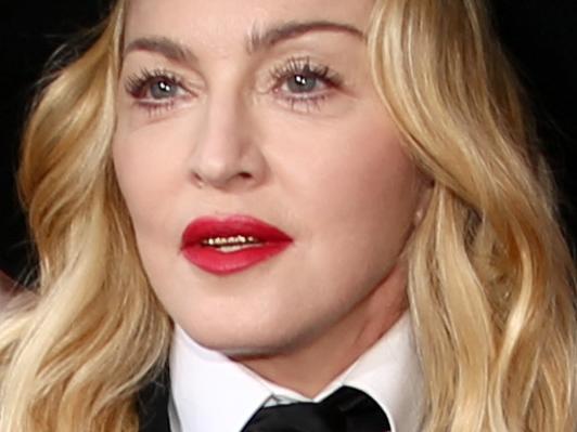 LOS ANGELES, CA - JANUARY 26: Recording artist Madonna (R) and David Banda attend the 56th GRAMMY Awards at Staples Center on January 26, 2014 in Los Angeles, California. (Photo by Christopher Polk/Getty Images for NARAS)