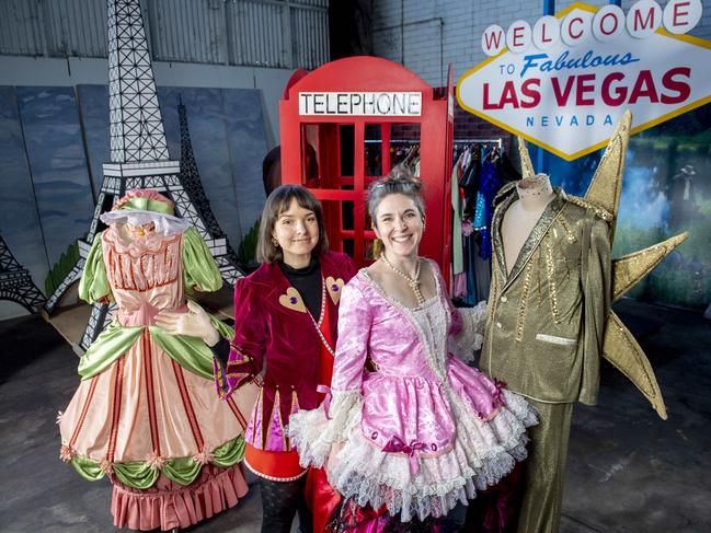 Enken Hagge and Martine Micklem from the State Theatre Company wearing costumes amid props from past productions going on sale this weekend. Picture: Mark Brake