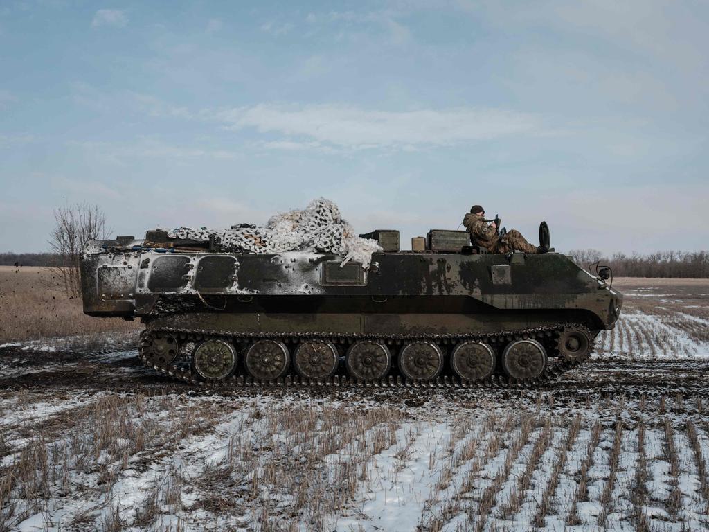 A Ukrainian armoured personnel carrier runs in the field near Bakhmut amid the Russian invasion of Ukraine. Picture: AFP