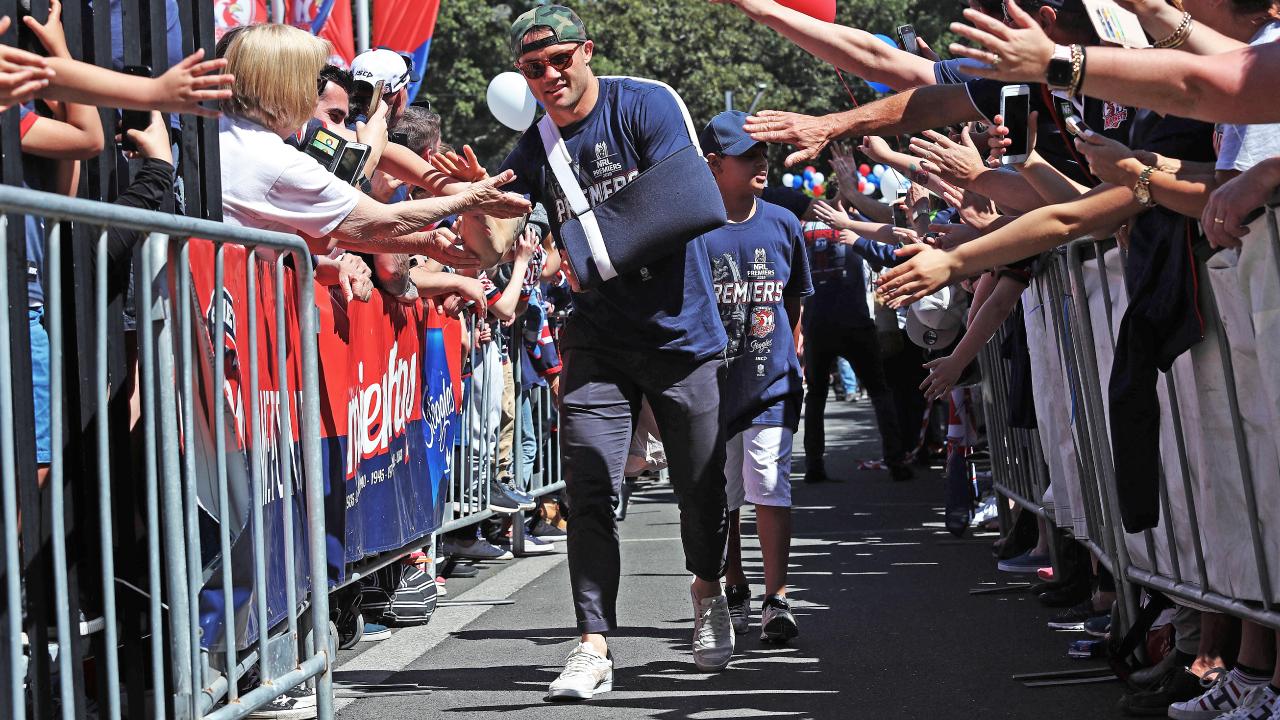 Cooper Cronk arrives to the Roosters Fan Day a battered hero. Picture: Brett Costello