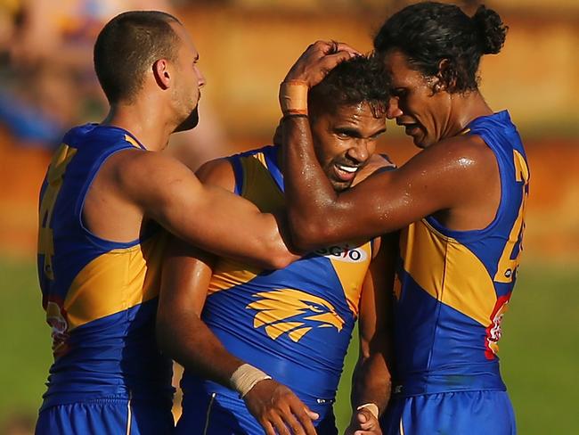 PERTH, AUSTRALIA - FEBRUARY 25: Lewis Jetta of the Eagles is congratulated by Dom Sheed and Francis Watson after kicking a goal late in the 4th quarter during the JLT Community Series AFL match between the West Coast Eagles and the Port Adelaide Power at Leederville Oval on February 25, 2018 in Perth, Australia.  (Photo by Paul Kane/Getty Images)