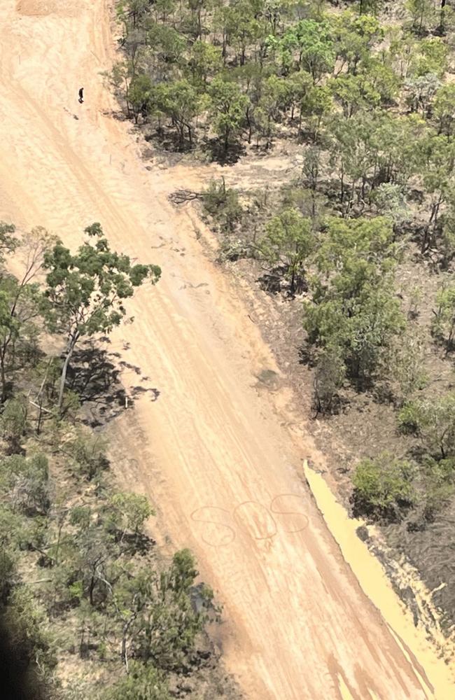 The husband and wife had scribbled “SOS” in the dirt. Picture: LifeFlight