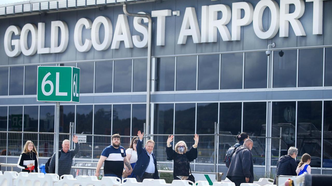 Passengers arrive at the Gold Coast Airport minutes after the borders were opened by the Queensland Government. Picture: Scott Powick