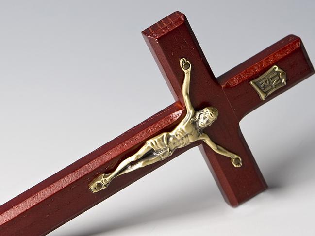 This photo provided by the National Labor Committee shows a crucifix (model # SE04309) produced at the Junxingye factory in Dongguan City, China, and purchased at the gift shop of the Episcopal Trinity Church in New York on Nov. 16, 2007. This crucifix and others from the same order were distributed by the Singer Co. of Mount Vernon, N.Y., to Trinity Church, St. Patricks Cathedral, and other religious stores around the country. The National Labor Committee, a New York-based labor rights group, released a report Tuesday, Nov. 20, denouncing the "horrific" sweatshop conditions under which the Christian religious items are made at the Junxingye factory. (AP Photo/National Labor Committee) **NO SALES; PHOTO PROVIDED BY THE NATIONAL LABOR COMMIT