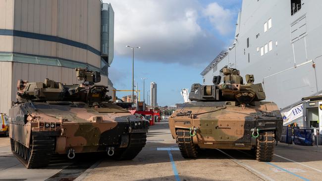 Australian Army Infantry Fighting Vehicles – Hanwha Defense Australia Redback, left, and the Rheinmetall Defence Australia KF-41 Lynx – stand ready to board HMAS Adelaide at Fleet Base East, NSW. Picture: Benjamin Ricketts / Department of Defence.