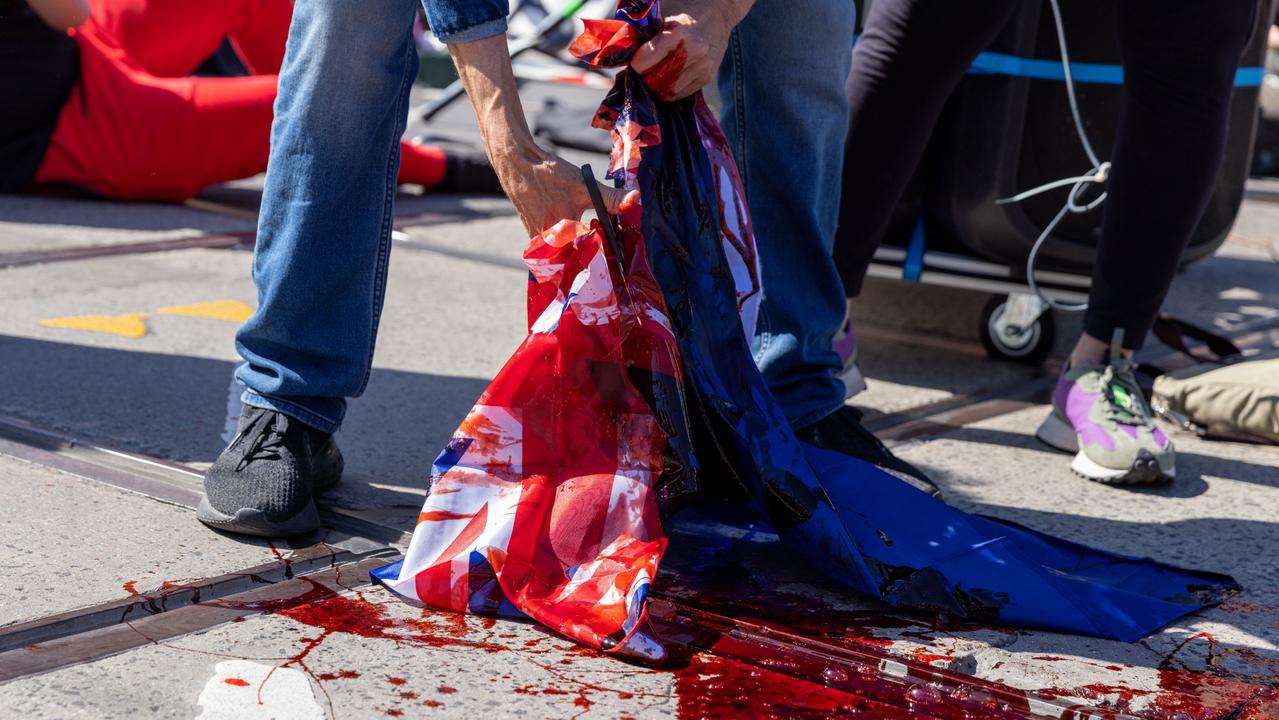 The Australian flag is defaced during a protest in Melbourne. Picture: Asanka Ratnayake/Getty Images