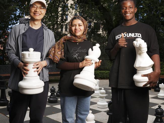 Julian Li originally from China, Fatemeh Papolzai originally from Afghanistan, Jeremie Kasigwas originally from the Democratic Republic of Congo who are all taking part in the migrant english program at TasTAFE and found a love for chess too.  Picture: Nikki Davis-Jones