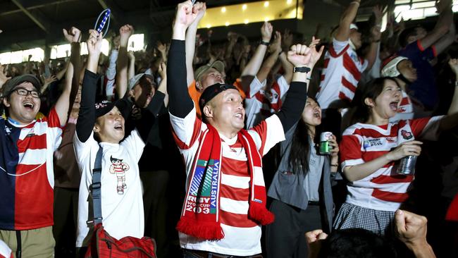 Japan rugby fans celebrate their team's second try.