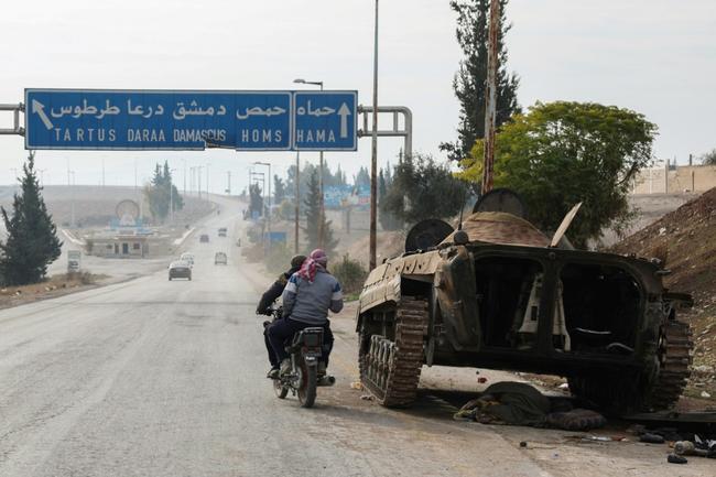 A Syrian government military vehicle lies abandoned in Hama governorate