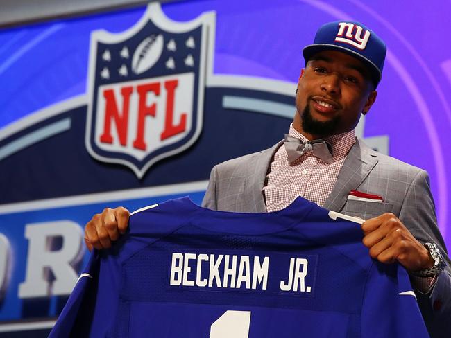 NEW YORK, NY - MAY 08: Odell Beckham Jr of the LSU Tigers poses with a jersey after he was picked #12 overall by the New York Giants during the first round of the 2014 NFL Draft at Radio City Music Hall on May 8, 2014 in New York City. (Photo by Elsa/Getty Images)