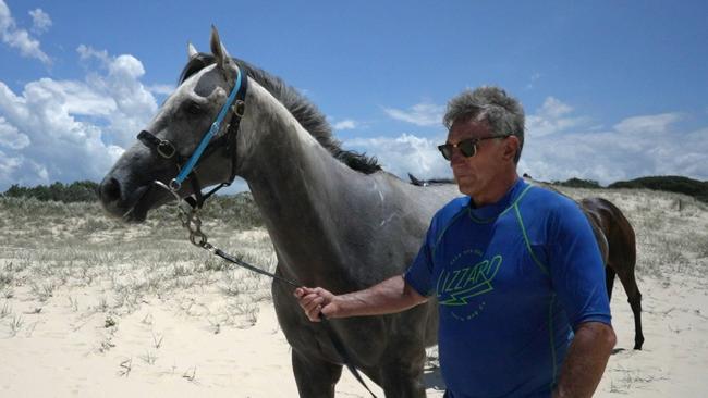 Sir Ravanelli and trainer Terry Evans at Tuncurry beach