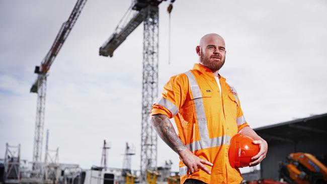 31/3/22 WEEKEND TELEGRAPH SPECIAL. MUST NOT USE BEFORE CLEARING WITH PIC EDITOR JEFF DARMANIN. Sydney crane driver Corey Nelson pictured at work today. Corey is an MMA fighter and the only man to defeat UFC champion Alexander Volkanovski. Picture: Sam Ruttyn