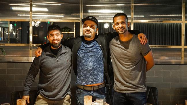 Basement Brewhouse vegan burger eating challenge winners: First place, Mehran Rouzbehi (middle); second place, Krushna Gorasia (right) and third Omar Salomon (left).