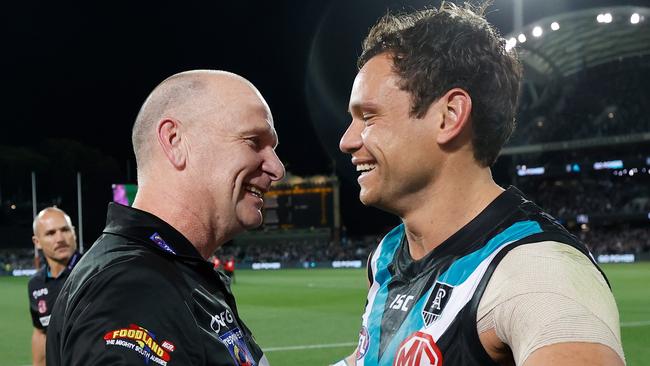 Ken Hinkley enjoys the qualifying final win with Steven Motlop, who booted three goals.