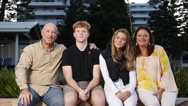 17-year-old Narooma teen Tom Haynes, with parents Rachael and Phil and his sister Jamie, 13 in Coogee. Tom is alive today only because he was one of the fortunate students to have a defibrillator installed at his school. Picture: Jonathan Ng