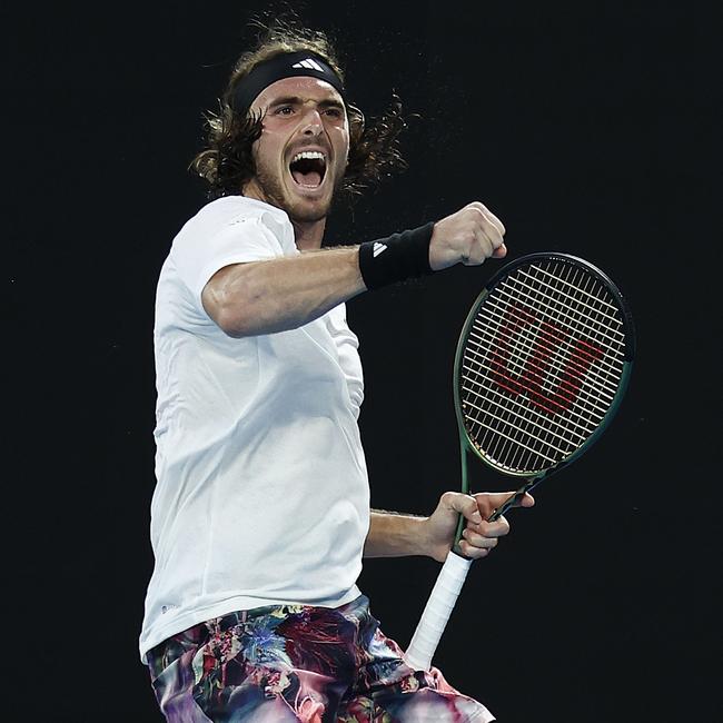 Stefanos Tsitsipas celebrates winning a point.