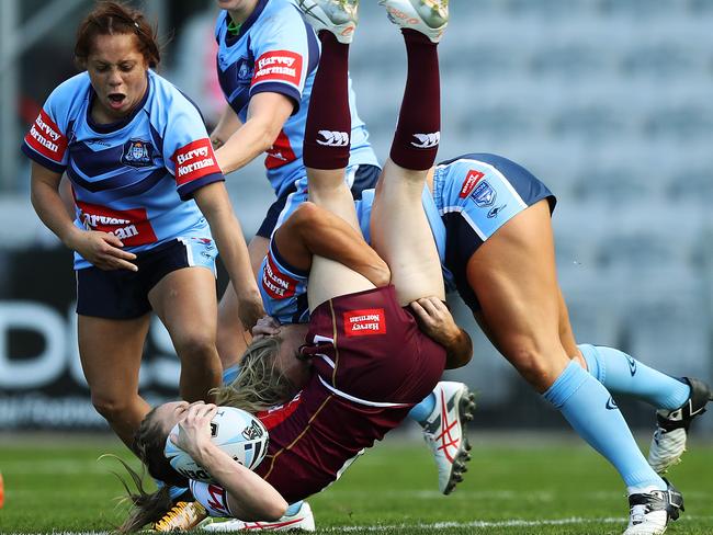 NSW Ruan Sims tackles Karina Brown during the Interstate Challenge at WIN Stadium Pict: Brett Costello