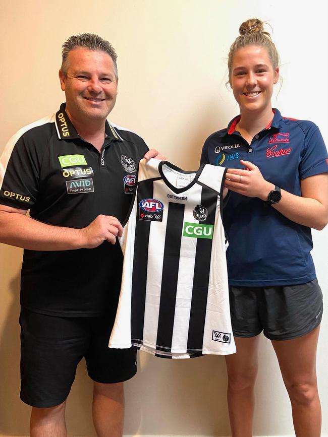 Collingwood AFLW coach Steve Symonds hands Bella Smith her Collingwood guernsey after being selected in the AFLW. Picture: Bella Smith