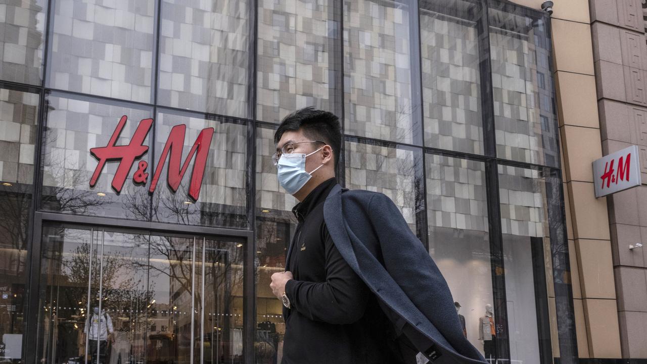 A man walks by an H&amp;M clothing store in Beijing, China. Chinese state media and social networking platforms called for boycotts of major Western brands, including H&amp;M. Picture: Kevin Frayer/Getty Images