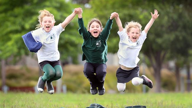 Epping Views primary students Bonnie, 8, Amber, 8, and Lucy 6. The school has seen the positive impact of active transport. Picture: Alex Coppel.