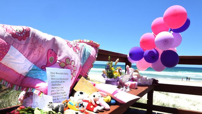 A memorial was created on Surfers Paradise beach near where a nine-month-old baby was found dead in November last year. Picture: AAP/John Gass)