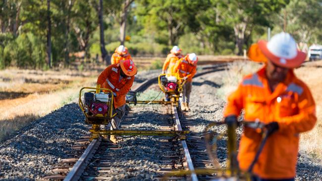 Workers on the Parkes to Narromine section of the Inland Rail project in NSW which is complete.